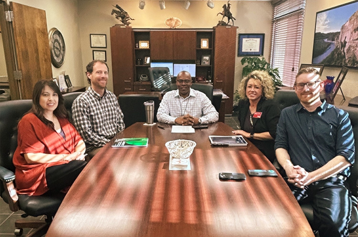 Cohort One - Group One discussing year-two projects with Derek Moore, Ed.D.