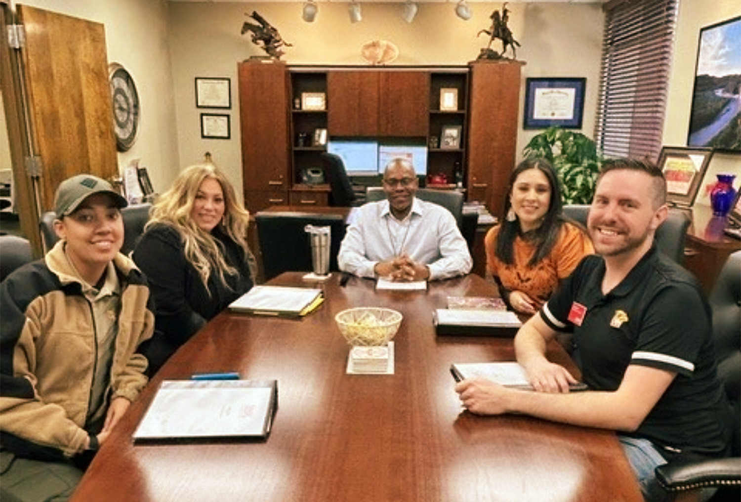 Cohort One - Group Four discussing year-two projects with Derek Moore, Ed.D.